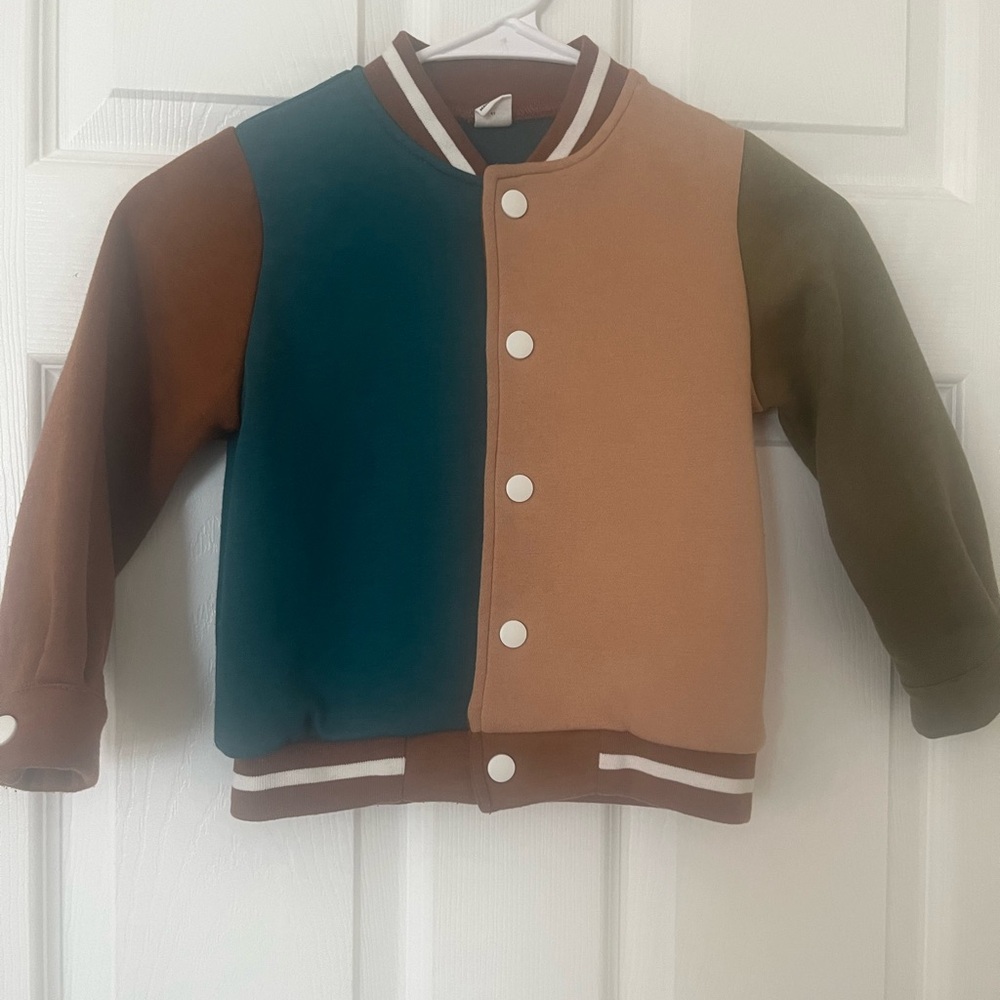 Kids size 5 brown/green color blocking varsity jacket with snap closure‎